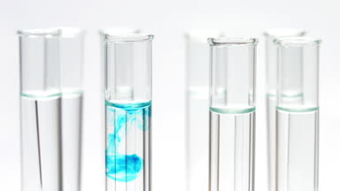 Drop blue liquid in test tube with water