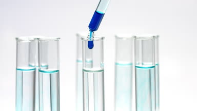 Drop blue liquid in test tube with water