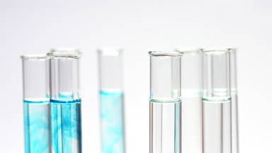 Drop blue liquid in test tube with water