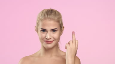 Young attractive woman showing a middle finger gesture