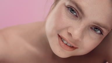 Young adult woman looking at the camera and smiling