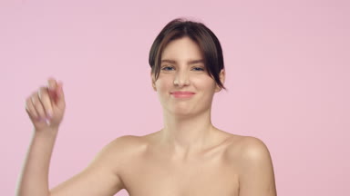 Young brunette woman throws out women shave razor and smiles.