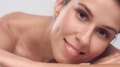 Beauty woman looks at the camera and smiles