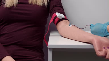 Medium close-up shot of vein blood sampling procedure
