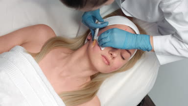 Doctor performs platelet rich plasma face injections