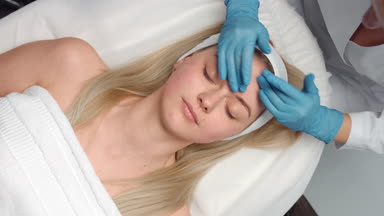 Facial massage procedure top view shot