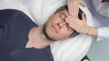 Cosmetology facial massage procedure Male patient