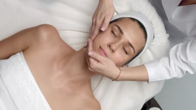 Time lapse of Cosmetology facial massage procedure young woman