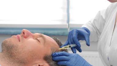 Close-up of male patient while PRP injections procedure