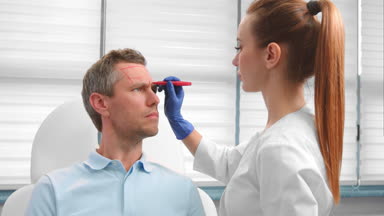 Doctor marking patient's face before botulinum toxin injections
