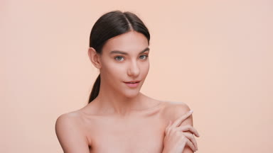 Fresh looking beauty model turns to the camera and smiles
