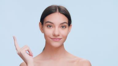 Young woman with perfect skin got an idea