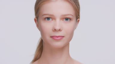 Beauty model raise her head and looks at the camera
