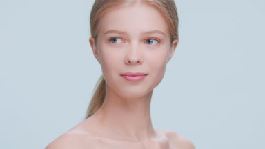 Amateur beauty model looks at the camera and smiles