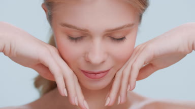 Beauty model raises her head and looks at the camera