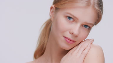 Blonde beauty model posing and looking at camera