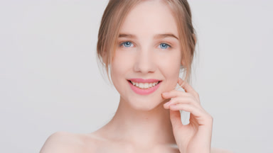 Beauty model posing for skincare products commercial