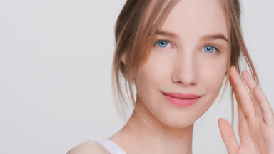 Young beauty model posing for skincare product commercial
