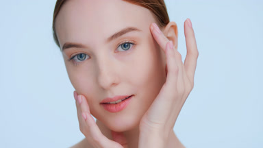 Young ginger woman posing for skin care and beauty products ads