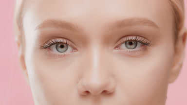 Female model opens eyes moving head up and looking at the camera