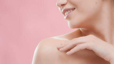 Woman turns her head from side to side touching her collar bones