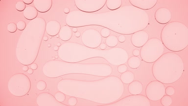 Light pink different sized stretched bubbles take round shape