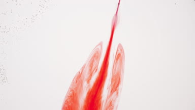 Liquid with tiny transparent bubbles is injected into white one