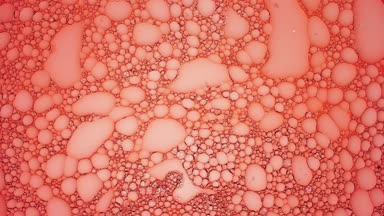 Big clear bubble slides along red smaller ones moving them