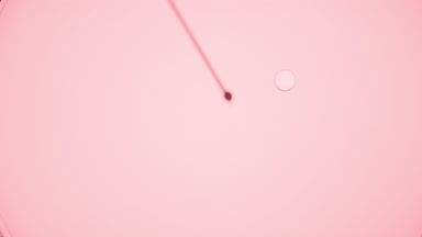 Clear small drops are injected into clear liquid from syringe