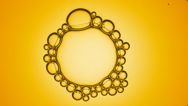 Cluster of six small bubbles joins to big bubble with small ones