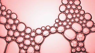 Transparent different sized bubbles explode spontaneously
