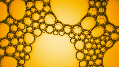 Different sized oily bubbles explode spontaneously at a time