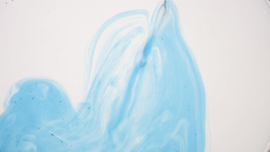 Blue fluid with tiny grey bubbles is injected into white one