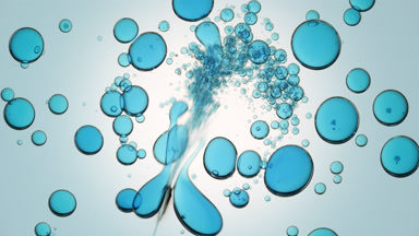Blue liquid is injected into transparent one with blue bubbles