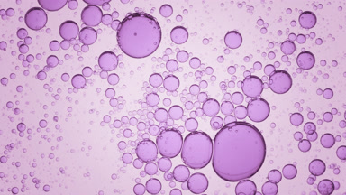 Violet transparent bubbles move spontaneously in clear fluid