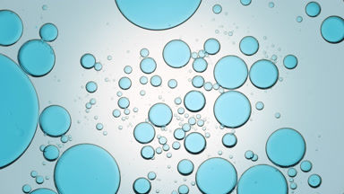 Blue different sized bubbles move slowly and spontaneously