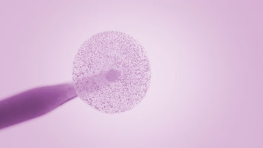 Purple drop with bubbles of glycerol is dripped from dropper