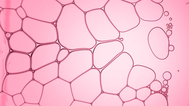 Clear liquid flows between transparent bubbles making them move