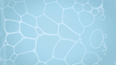 Liquid flows between white clear bubbles making them move