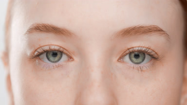 European female skincare model blinking occasionally