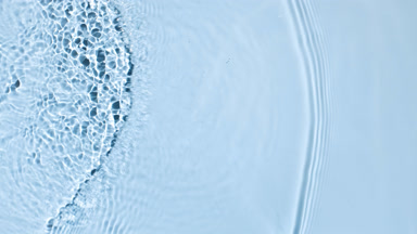 Multiple waves makes ripples on water surface on blue background