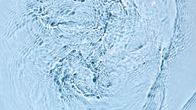 Water ripples and waves on blue background