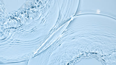 Water flows from opposite sides creating waves and ripples