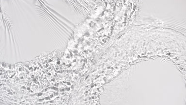 Water flows creating waves, ripples and concentric circles