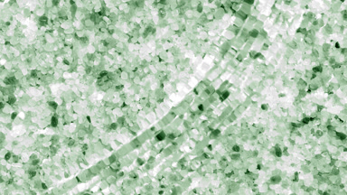 Water waves and ripples crossing over green mineral crystals