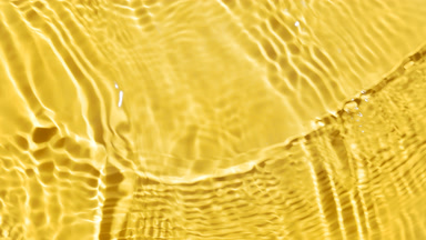 Water waves crossing and splashing on yellow background