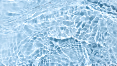 Water waves crossing and splashing on blue background