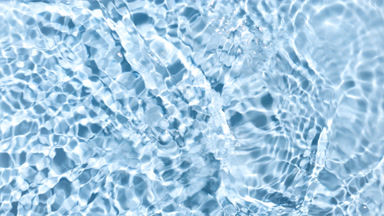Water ripples waves and splashes on blue background