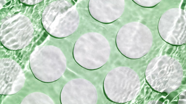 Water waves crossing against cotton pads on green bg