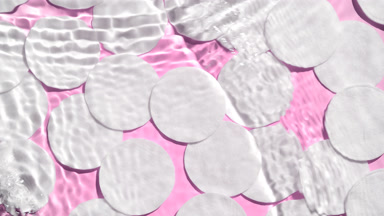 Waves plashing against cotton pads vibrant pink bg